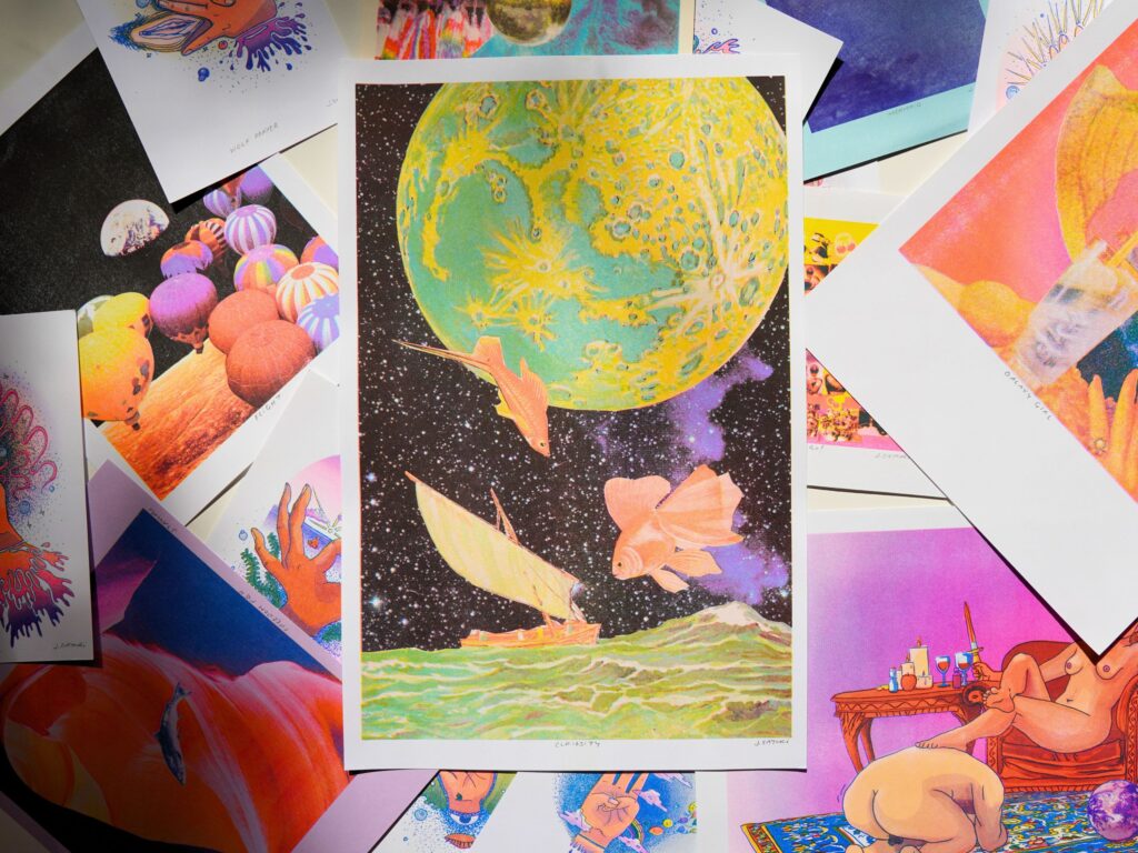 Curiosity risograph print on top of a spread of other risograph prints