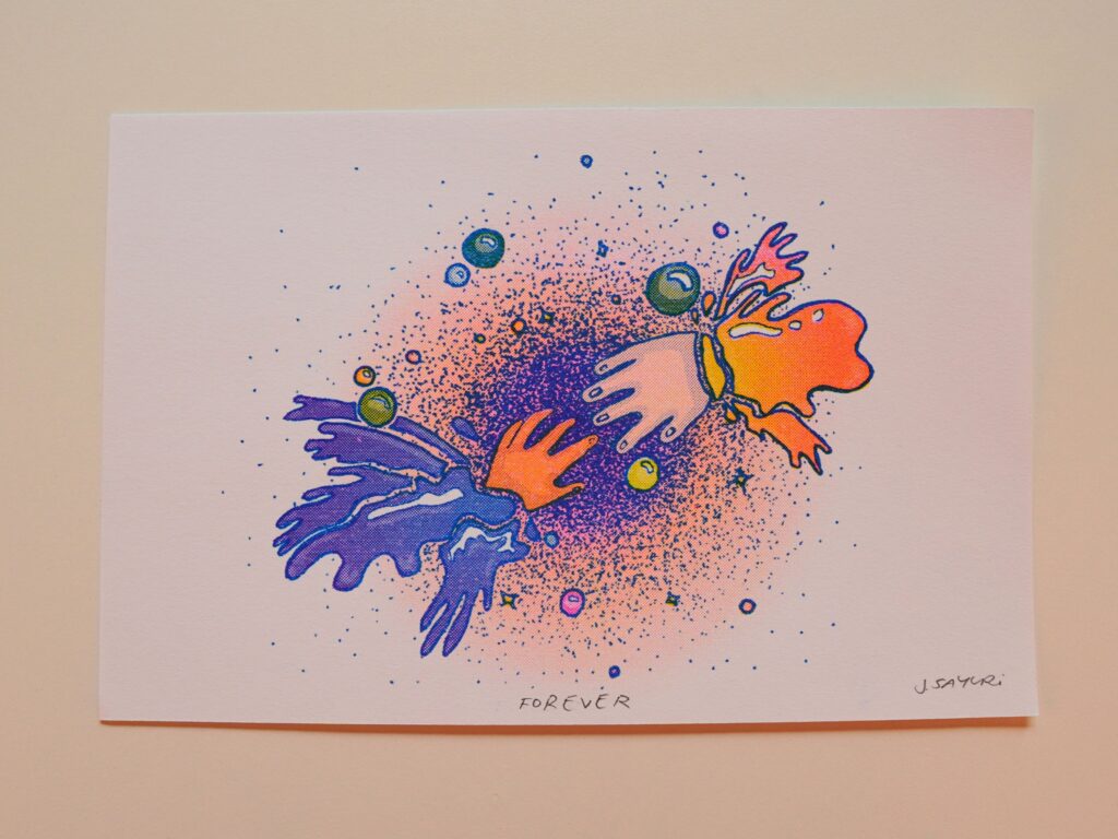 Healing Hands print of two hands reaching toward each other through a starry spray of color