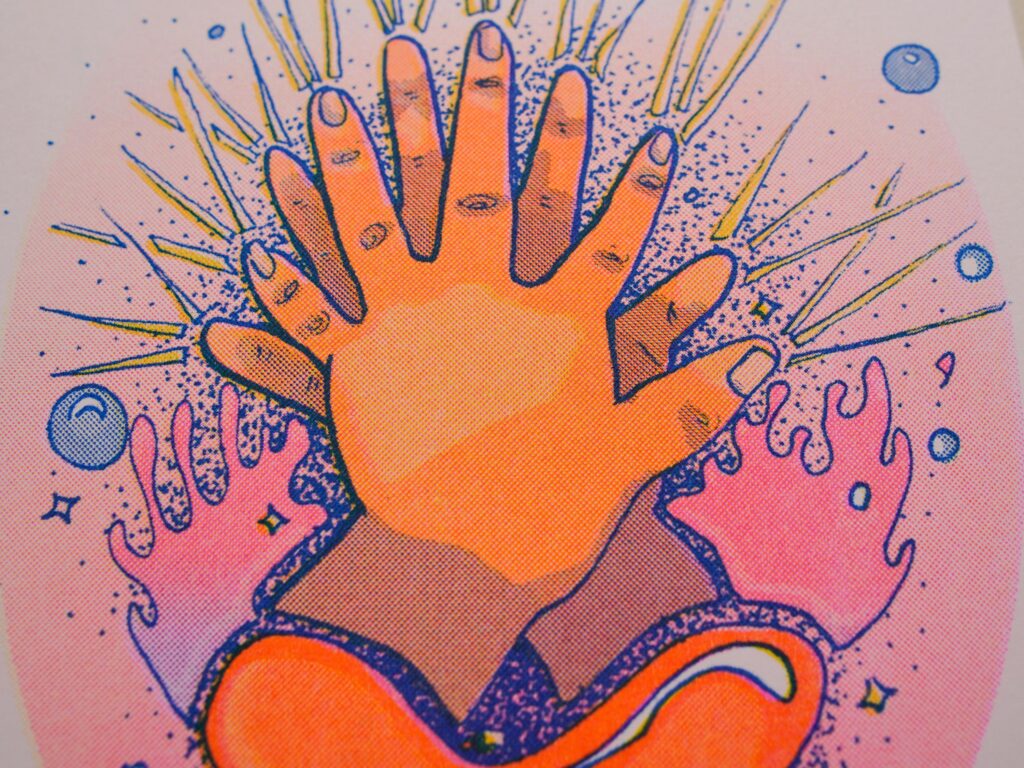 Close-up of a Healing Hands print showing an open hand and the risograph ink texture