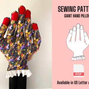 Giant Hand Pillow sewing pattern PDF: a giant hand pillow in swirled print fabric with red fingertips